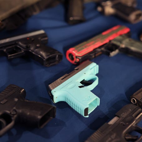 Confiscated guns are displayed on a table ahead of a New York Mayor Eric Adams press conference on Public Safety at City Hall on June 03, 2025 in New York City.