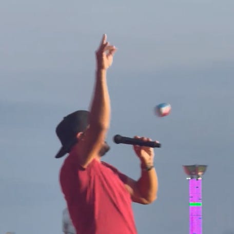 Country singer Luke Bryan was hit in the head by a ball thrown from the audience during a performance at the North Dakota State Fair in Minot.