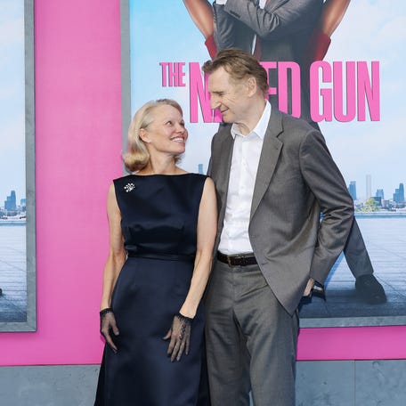 Pamela Anderson and Liam Neeson gaze at each other, sparking romance rumors at the New York premiere of "The Naked Gun" on July 28, 2025, in New York City.