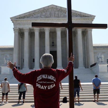 Demonstrators gather outside the U.S. Supreme Court as the court ruled that religious institutions like churches and schools are shielded from employment discrimination lawsuits in Washington, U.S., July 8, 2020.