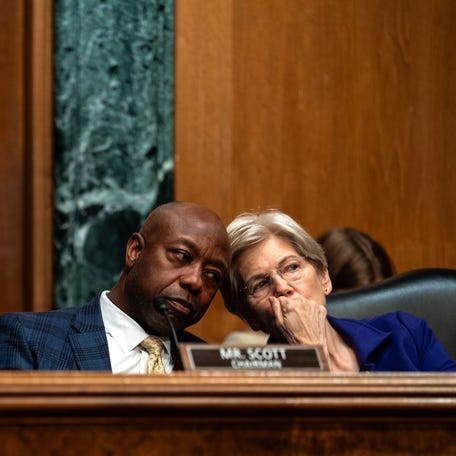 Committee Chairman Sen. Tim Scott (R-SC) chats with ranking member Sen. Elizabeth Warren (D-MA).