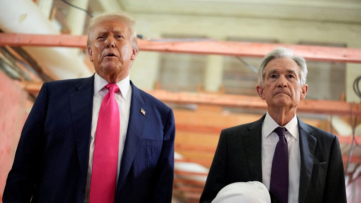 President Donald Trump and Federal Reserve Chair Jerome Powell speak during a tour of the Federal Reserve Board building, which is currently undergoing renovations, in Washington, D.C. on July 24, 2025.
