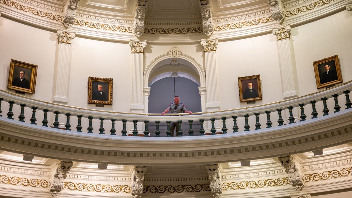 A law enforcement officer stands near the entrance to the House of Representatives in the State Capitol on July 21, 2025 in Austin, Texas. Lawmakers are gathering for a special session to discuss an agenda outlined by Gov. Greg Abbott that seeks to address flood relief in response to the Central Texas floods that killed more than 100 people, congressional redistricting, and THC products.