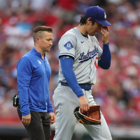 Los Angeles' Shohei Ohtani is removed as a pitcher in the fourth inning against the Cincinnati Reds.