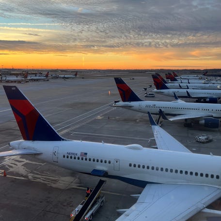 Delta planes sit at gates at Hartsfield-Jackson Atlanta International Airport on Dec. 8, 2024.
