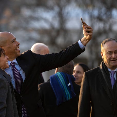Vice President Kamala Harris and Sen. Cory Booker (D-NJ) take a picture together during a signing ceremony for the Respect for Marriage Act on the South Lawn of the White House December 13, 2022 in Washington, DC.