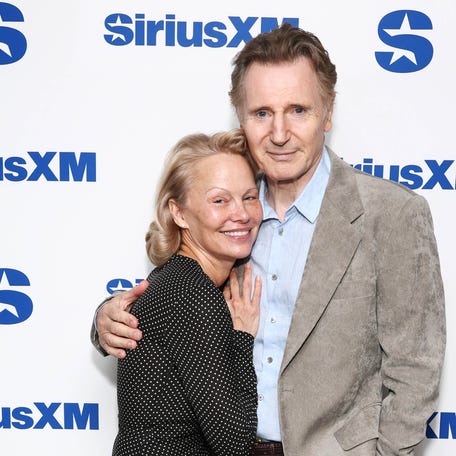 Pamela Anderson and Liam Neeson attend SiriusXM's Town Hall with the cast of "The Naked Gun" hosted by Andy Cohen at SiriusXM Studios on July 30, 2025, in New York City.