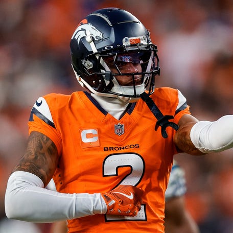 Denver Broncos cornerback Pat Surtain II (2) gestures after a play in the third quarter against the Indianapolis Colts at Empower Field at Mile High.
