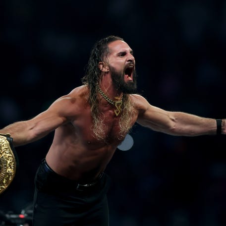 Seth Rollins celebrates after winning the WWE World Heavyweight Championship after cashing in his Money in the Bank contract to take on CM Punk during the WWE 2025 SummerSlam at MetLife Stadium on August 02, 2025 in East Rutherford, New Jersey.