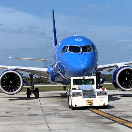 A Breeze Airways jet is pushed toward the runway Sunday, Feb. 16, 2025, at Vero Beach Regional Airport in Florida.