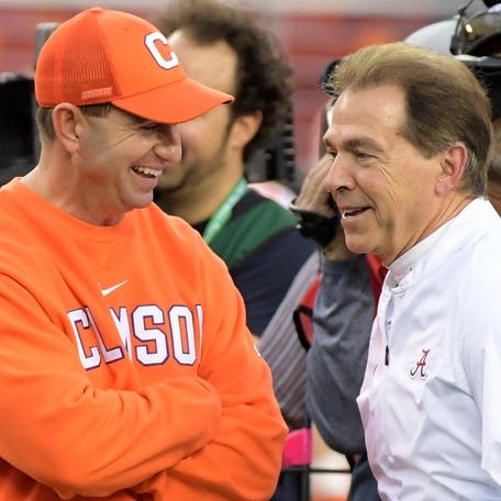 Jan 7, 2019; Santa Clara, CA, USA; Clemson Tigers head coach Dabo Swinney and Alabama Crimson Tide head coach Nick Saban smile on the field before the 2019 College Football Playoff Championship game at Levi's Stadium. Mandatory Credit: Kirby Lee-USA TODAY Sports