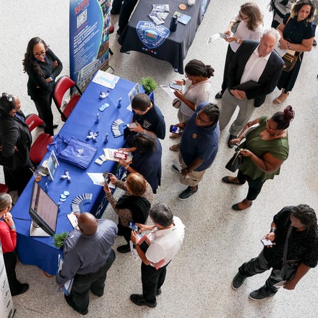People visit the City of Sunrise booth at the Mega JobNewsUSA South Florida Job Fair at the Amerant Bank Arena on April 30, 2025 in Sunrise, Florida. Over 150 local hiring managers & recruiters were at the job fair to recruit workers for thousands of positions in Miami, Broward, and Palm Beach County.