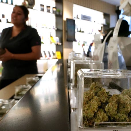 Faith Ornelas of Oxnard shops at The Artist Tree cannabis dispensary in Oxnard, California, on July 3, 2025.