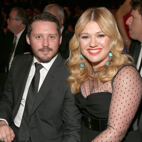Kelly Clarkson, right, and Brandon Blackstock attend the 55th annual Grammy Awards at Staples Center in Los Angeles on Feb. 10, 2013.