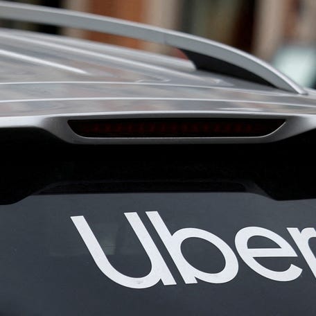 The Uber logo is seen on the rear window of a taxi in Dublin, Ireland, June 29, 2025.