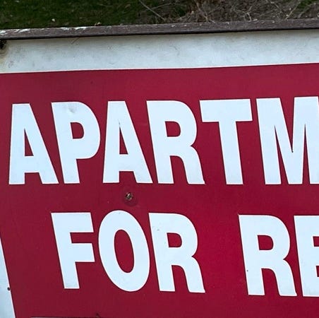 Apartment for Rent sign.