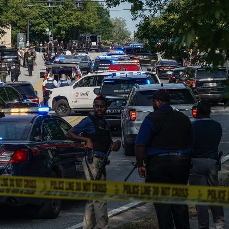 Law enforcement is seen near the Centers For Disease Control (CDC) Global Headquarters during an active shooter incident on Aug. 8, 2025, in Atlanta, Georgia. According to the Atlanta Police Department, the suspect in the active shooter situation is dead and a police officer was injured.