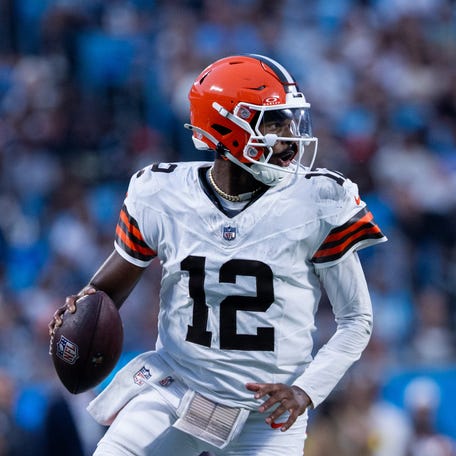 Cleveland Browns quarterback Shedeur Sanders (12) looks down field during the second quarter against the Carolina Panthers.