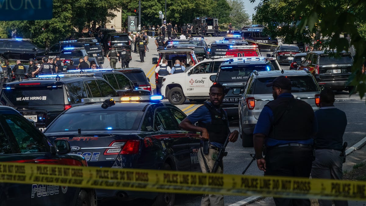Law enforcement is seen near the Centers For Disease Control (CDC) Global Headquarters during an active shooter incident on Aug. 8, 2025, in Atlanta, Georgia. According to the Atlanta Police Department, the suspect in the active shooter situation is dead and a police officer was also killed.