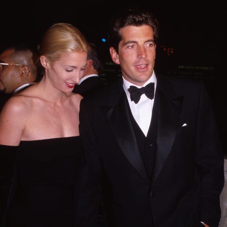 John F. Kennedy, Jr., with his wife Carolyn Bessette attend a function in honor of his mother, Jacqueline "Jackie" Kennedy Onassis on Oct. 4, 1998, at Grand Central Station in New York City.