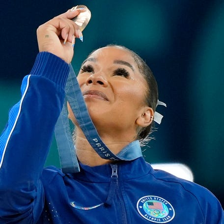 Aug 5, 2024; Paris, France; Jordan Chiles of the United States celebrates her bronze medal on the floor exercise during the Paris 2024 Olympic Summer Games. Mandatory Credit: Jack Gruber-USA TODAY Sports