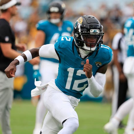 Jacksonville Jaguars wide receiver Travis Hunter (12) runs a route before an NFL preseason matchup at EverBank Stadium.