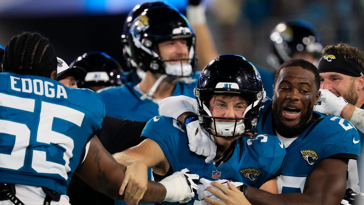 Jacksonville Jaguars place kicker Cam Little (39) is congratulated by teammates after his 70-yard field goal.