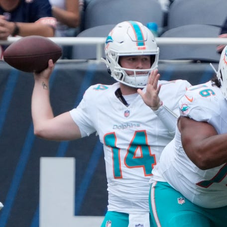Aug 10, 2025; Chicago, Illinois, USA; Miami Dolphins quarterback Quinn Ewers (14) passes the ball against the Chicago Bears during the second half at Soldier Field.