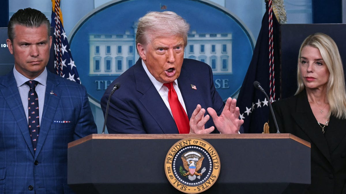 From left, Defense Secretary Pete Hegseth, President Donald Trump and Attorney General Pam Bondi brief reporters on their plans for Washington, DC, on Aug. 11, 2025.