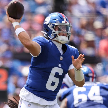 Jaxson Dart of the New York Giants throws a pass during the first quarter of an NFL Preseason 2025 game between New York Giants and Buffalo Bills.