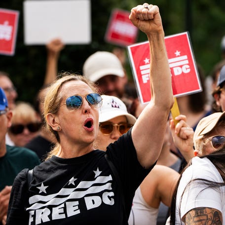 Protesters rally in downtown Washington D.C. near the White House on August 11, 2025, after President Donald Trump ordered an increased federal law enforcement presence across the streets of Washington, D.C., a federal takeover of Metro Police Department and the deployment of National Guard troop in the city. The president has increasingly criticized crime in Washington even as it's reached a 30-year low.
