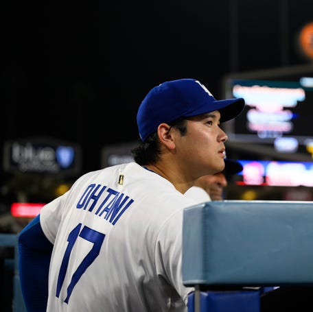Los Angeles Dodgers designated hitter Shohei Ohtani looks on from the dugout during the ninth inning against the St. Louis Cardinals at Dodger Stadium on Aug. 5, 2025.