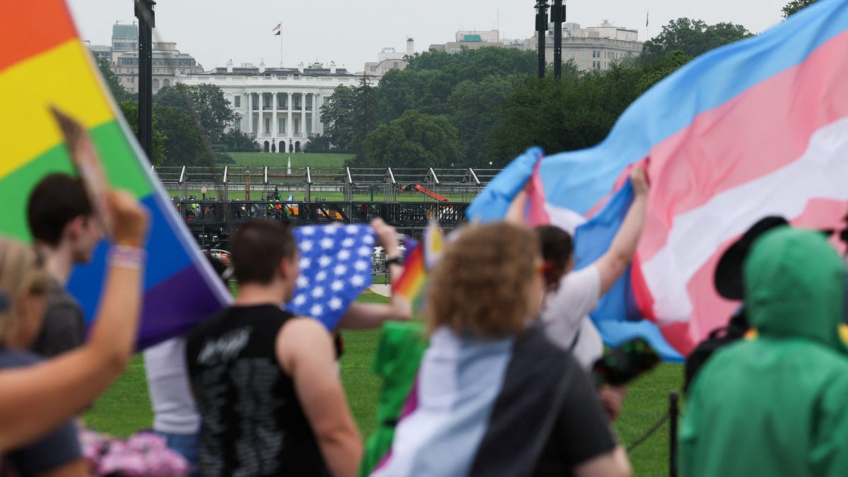 People attend the "International Rally + March on Washington for Freedom" in support of LGBTQ+ rights as part of WorldPride, with the White House in the background, in Washington, D.C., U.S., June 8, 2025.