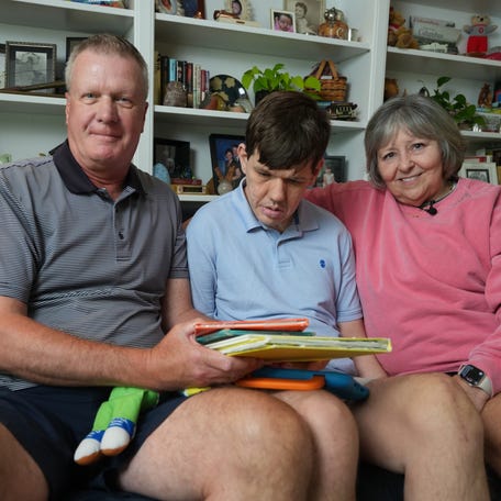 Jeff (left) and Karen Groff, of Upper Arlington, Ohio, are caregivers for their adult son Danny (center), who has Lennox-Gastaut syndrome.