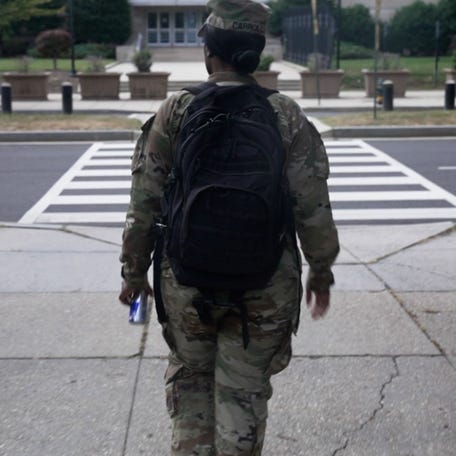 National Guard troops reported to DC Armory as part of a federal emergency deployment to restore public safety.