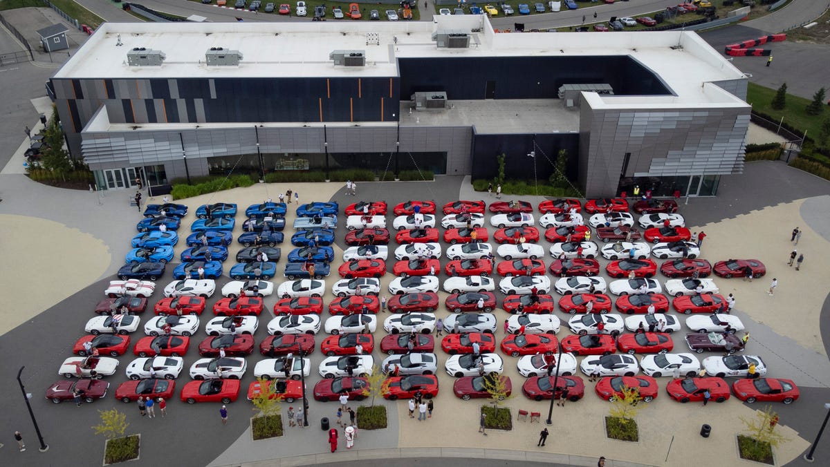 122 red, white and blue Corvettes are parked to form the American flag during the Corvettes on Woodward event at the M1 Concourse in Pontiac on Wednesday, Aug. 13, 2025 to help kick off the 2025 Woodward Dream Cruise.