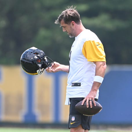 Pittsburgh Steelers quarterback Aaron Rodgers (8) looks over his helmet during minicamp at their South Side facility.