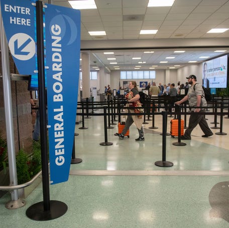 Air travelers at Pensacola International Airport line up to pass through security checkpoints on Wednesday, April 17, 2024.