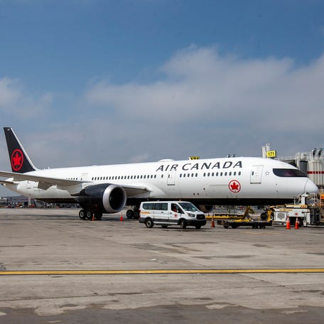 An Air Canada plane is parked at Toronto Pearson Airport in Mississauga, Ontario, Canada April 28, 2021. REUTERS/Carlos Osorio