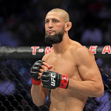 Khamzat Chimaev (red gloves) fights Kevin Holland (blue gloves) during UFC 279 at T-Mobile Arena on Sep 10, 2022.