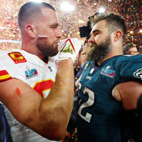 Kansas City Chiefs tight end Travis Kelce (87) talks with his brother Philadelphia Eagles center Jason Kelce (62) after he won Super Bowl LVII at State Farm Stadium in Glendale, Arizona on Feb. 12, 2023.