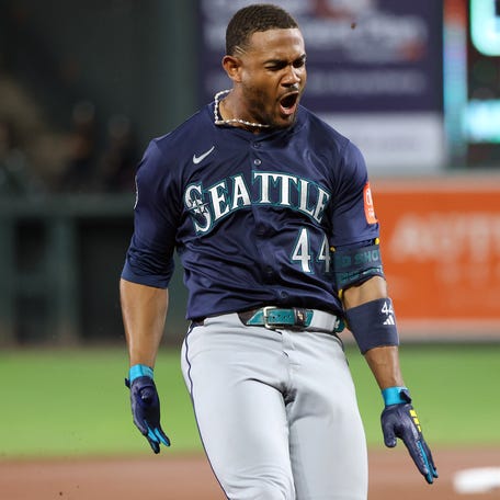 Seattle Mariners outfielder Julio Rodriguez celebrates after hitting a triple during the seventh inning against the Baltimore Orioles.