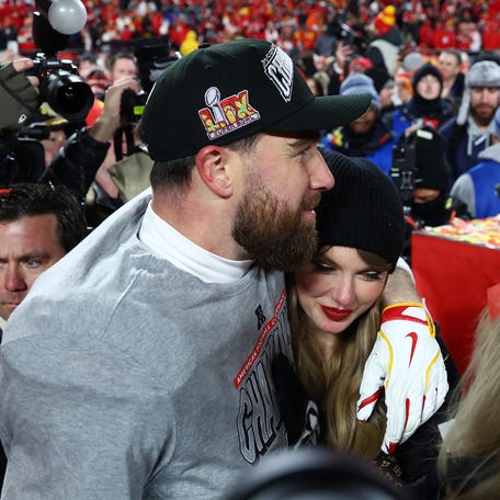 Jan 26, 2025; Kansas City, MO, USA; Recording artist Taylor Swift and Kansas City Chiefs tight end Travis Kelce (87) react after the AFC Championship game against the Buffalo Bills at GEHA Field at Arrowhead Stadium. Mandatory Credit: Mark J. Rebilas-Imagn Images
