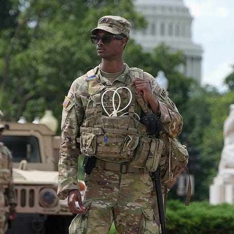 Members of the National Guard stand outside Union Station on August 14, 2025 in Washington, DC. President Donald Trump announced plans to deploy federal officers and the National Guard to the District and also placed the DC Metropolitan Police Department under federal control.