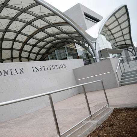 WASHINGTON, DC - MARCH 28: A Smithsonian Institution sign is seen on the National Air and Space Museum on the National Mall on March 28, 2025 in Washington, DC. U.S. President Donald Trump signed an executive order to reshape and remove contact that 
