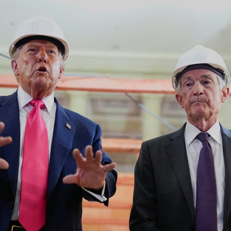 U.S. President Donald Trump speaks next to Federal Reserve Chair Jerome Powell during a tour of the Federal Reserve Board building, which is currently undergoing renovations, in Washington, D.C., U.S., July 24, 2025. REUTERS/Kent Nishimura
