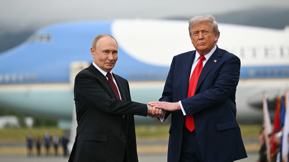 US President Donald Trump shakes hands with Russian President Vladimir Putin on the tarmac after they arrived at Joint Base Elmendorf-Richardson in Anchorage, Alaska, on August 15, 2025.