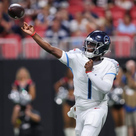 Tennessee Titans quarterback Cam Ward (1) throws a pass against the Atlanta Falcons.