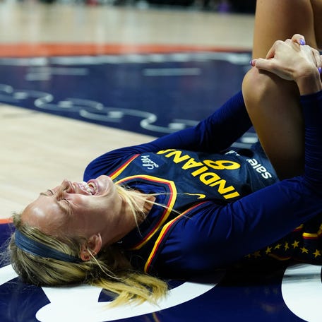Aug 17, 2025; Uncasville, Connecticut, USA; Indiana Fever guard Sophie Cunningham (8) on the court injured as they take on the Connecticut Sun in the first half at Mohegan Sun Arena.