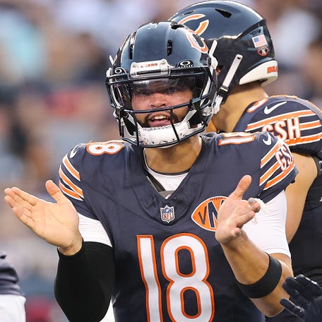 CHICAGO, ILLINOIS - AUGUST 17: Caleb Williams #18 of the Chicago Bears huddles with teammates against the Buffalo Bills during the NFL Preseason 2025 game between Buffalo Bills and Chicago Bears at Soldier Field on August 17, 2025 in Chicago, Illinois. (Photo by Michael Reaves/Getty Images)